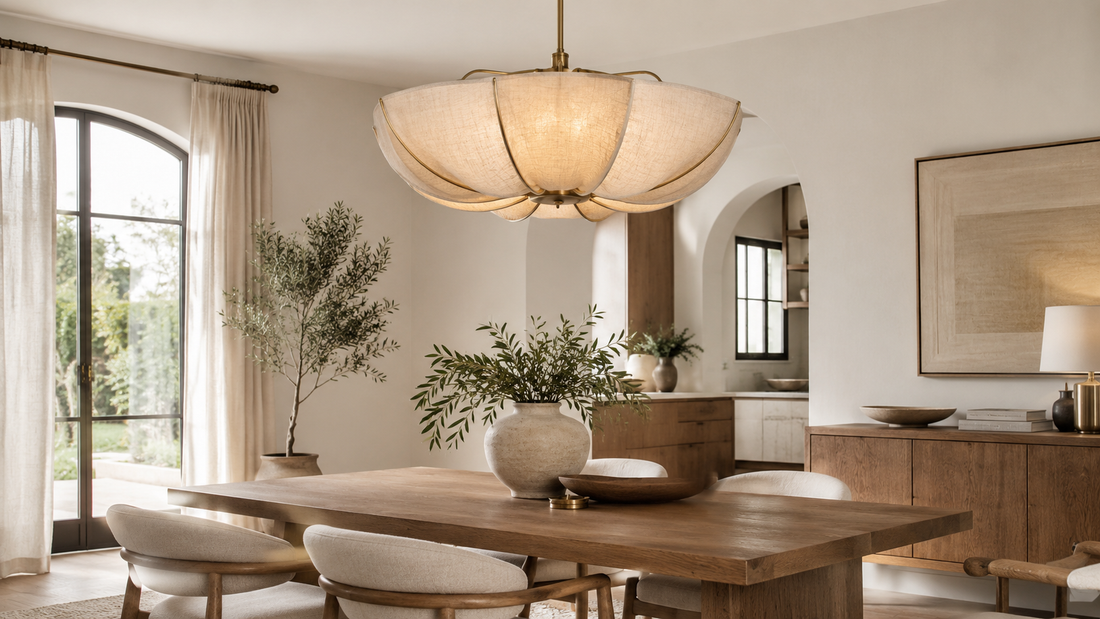 Linen chandelier above a wood dining table in a warm neutral Japandi interior