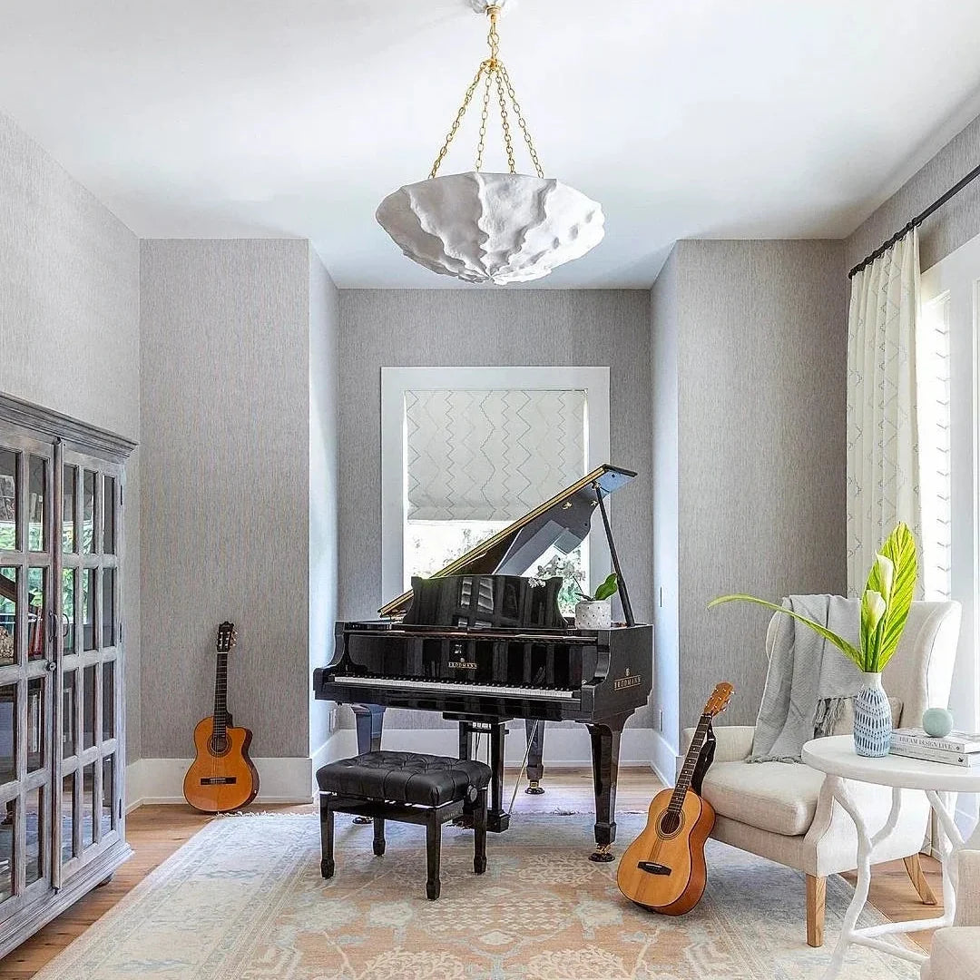 Sculptural petal chandelier with light gray-white shade and gold-tone chain