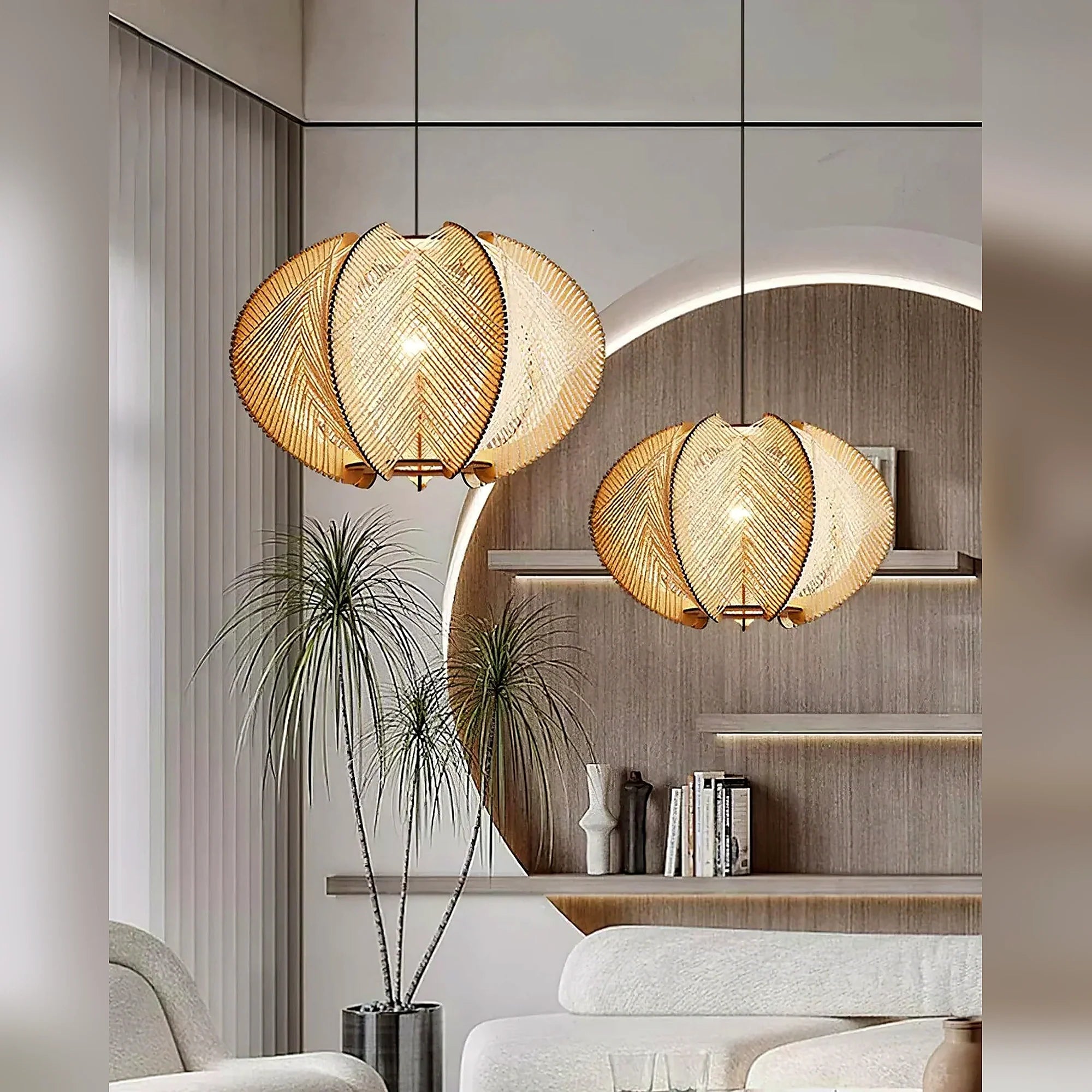 Two beige woven orbit pendant lamps with layered shades and exposed bulbs