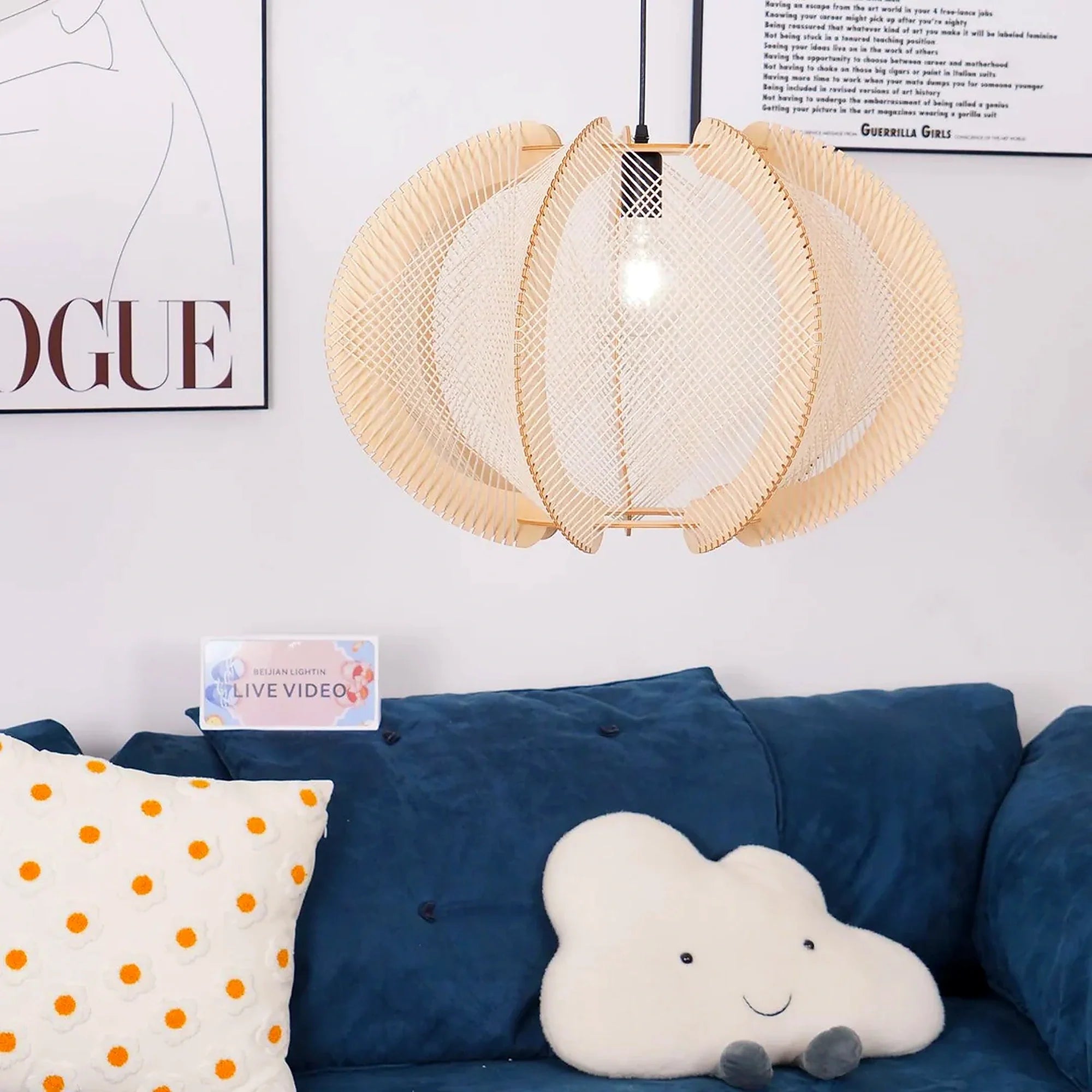 Beige woven orbit pendant lamp with layered round shade hanging from black cord