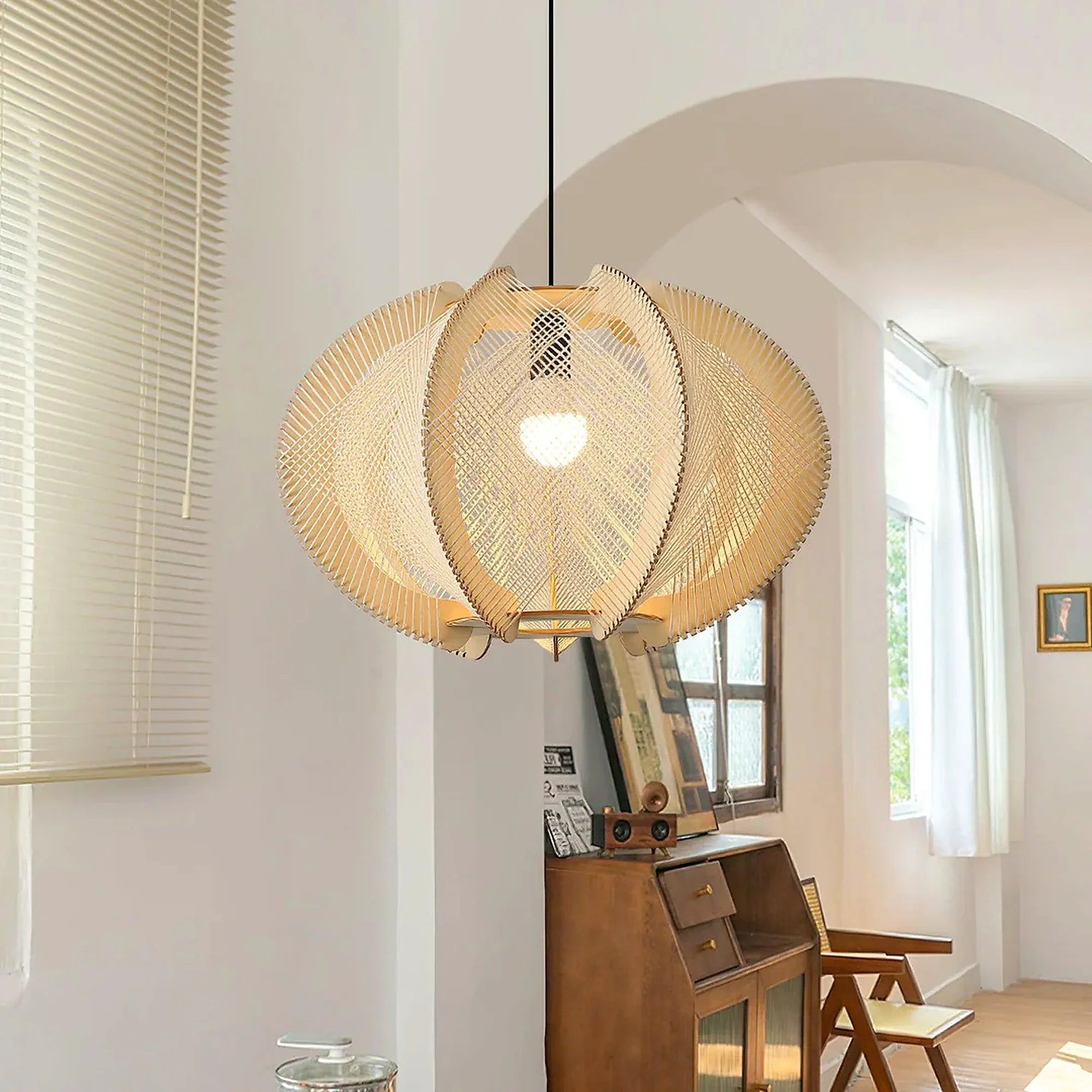 Beige woven orbit pendant lamp with layered orbit shade and exposed bulb