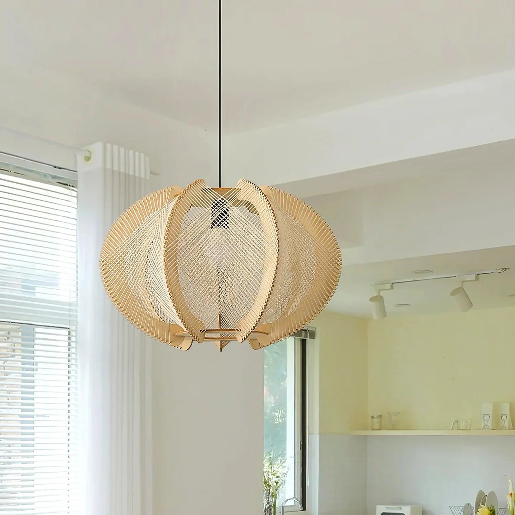 Beige woven orbit pendant lamp with woven circular shade and central bulb