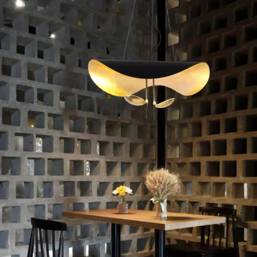 Gold and black foil disc pendant light with warm gold underside