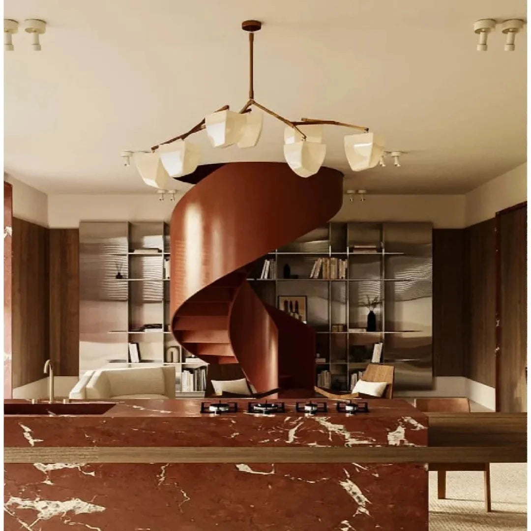 Brass branching chandelier above kitchen island with off-white cone shades