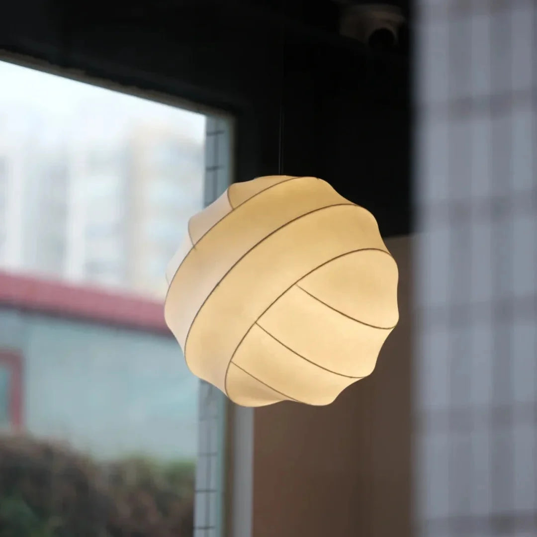 Luma silk pendant light, beige fabric shade hanging from a black cord