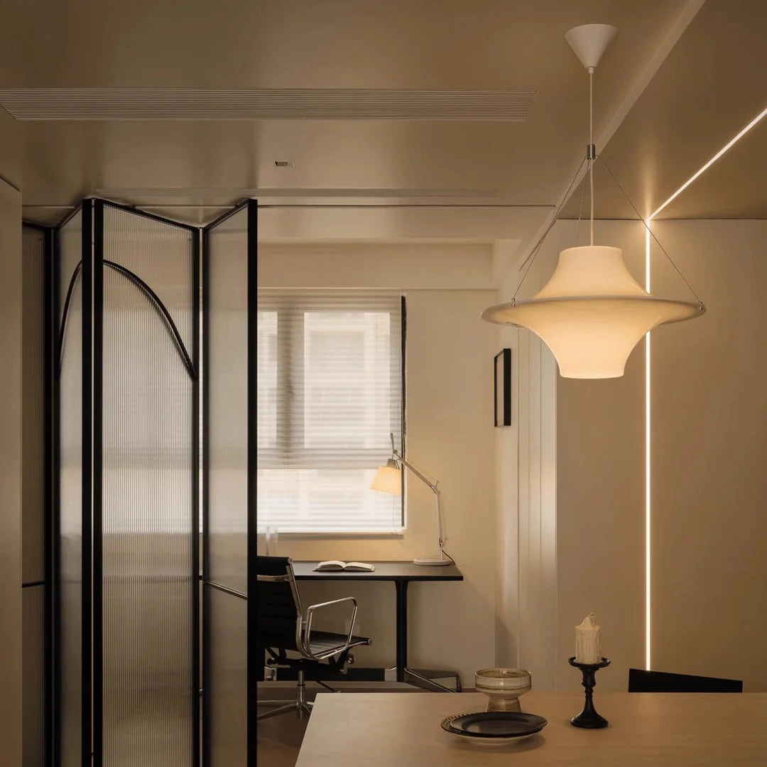 White opal disc pendant light with smooth curved shade and hanging cords