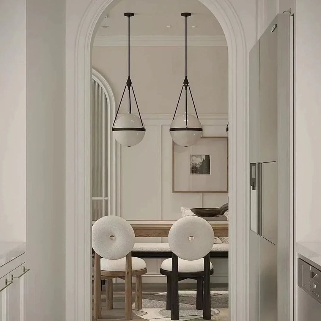 Glass globe pendant light with round white shades and black hanging cords