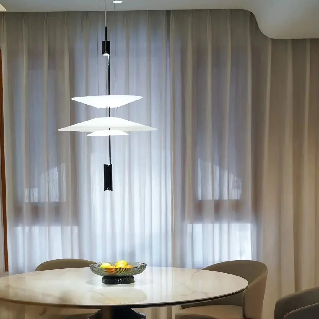 Stacked disc pendant chandelier with white disc shades and black central rod