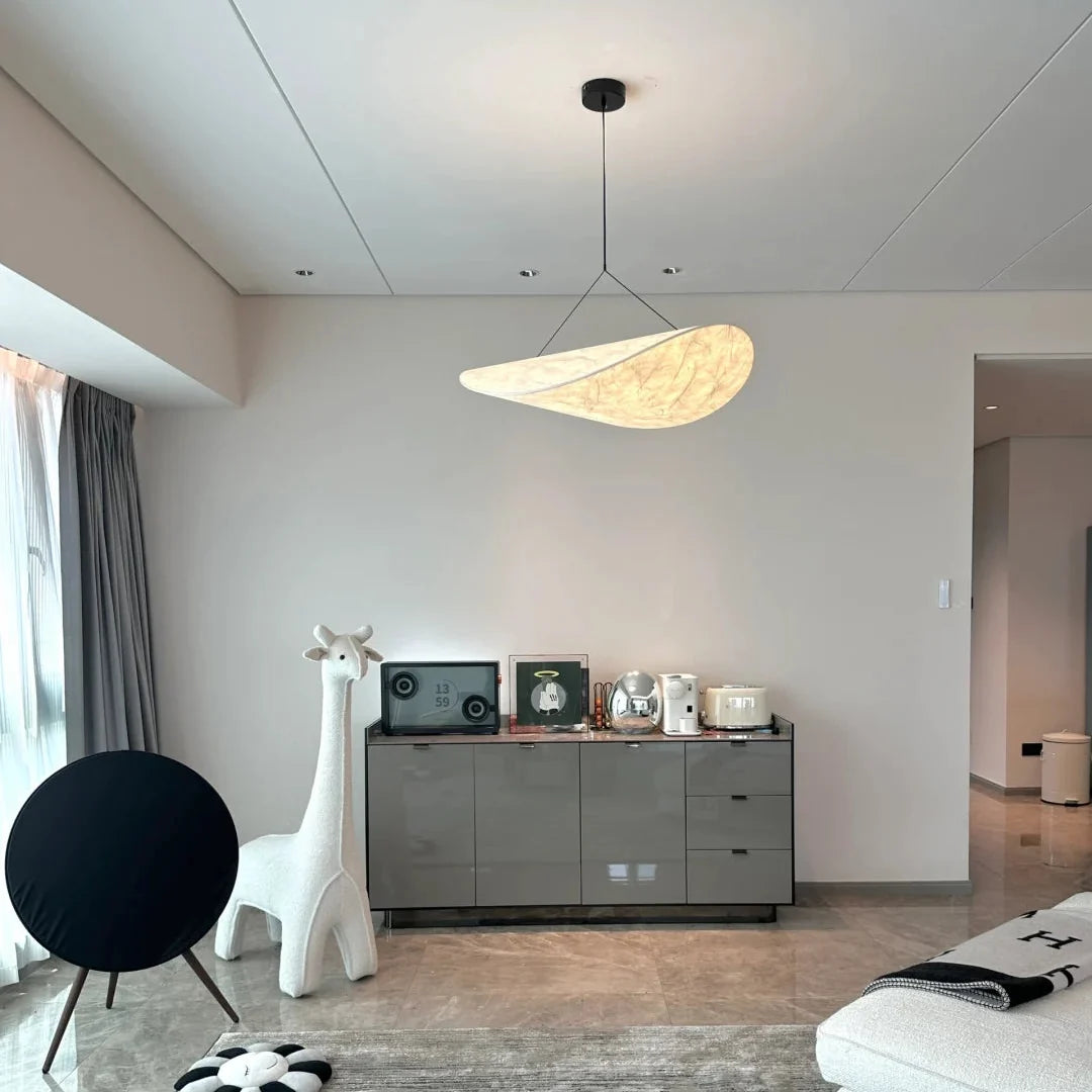 Oval paper pendant light with off-white paper shade and black canopy