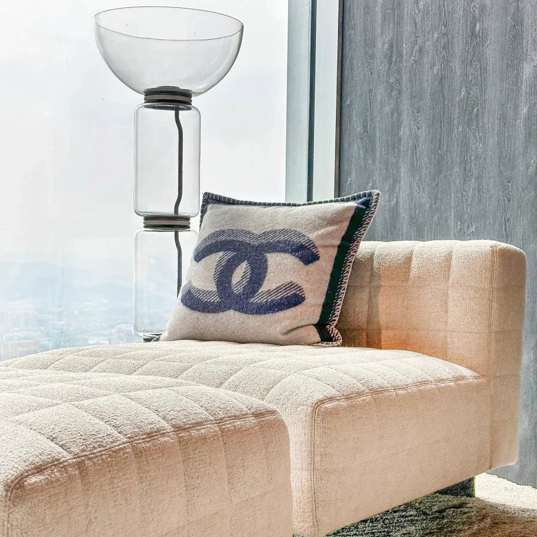Glass floor lamp with clear stacked cylinders and round metal base