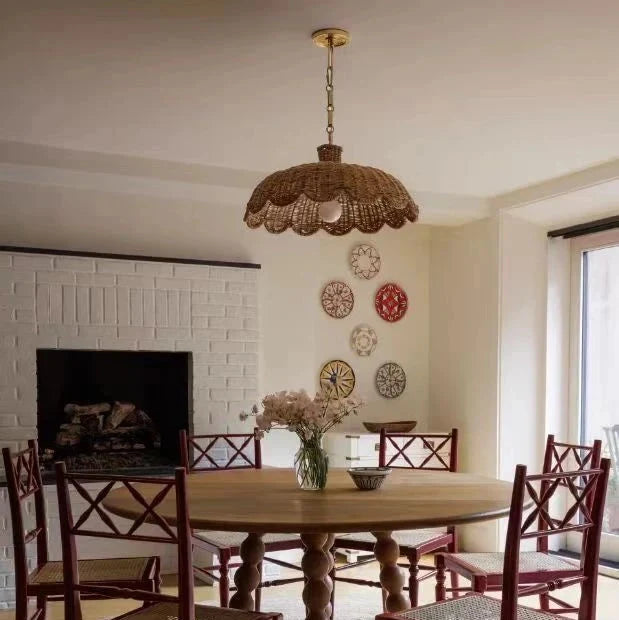 Caleta woven rattan pendant light with scalloped shade hanging by chain