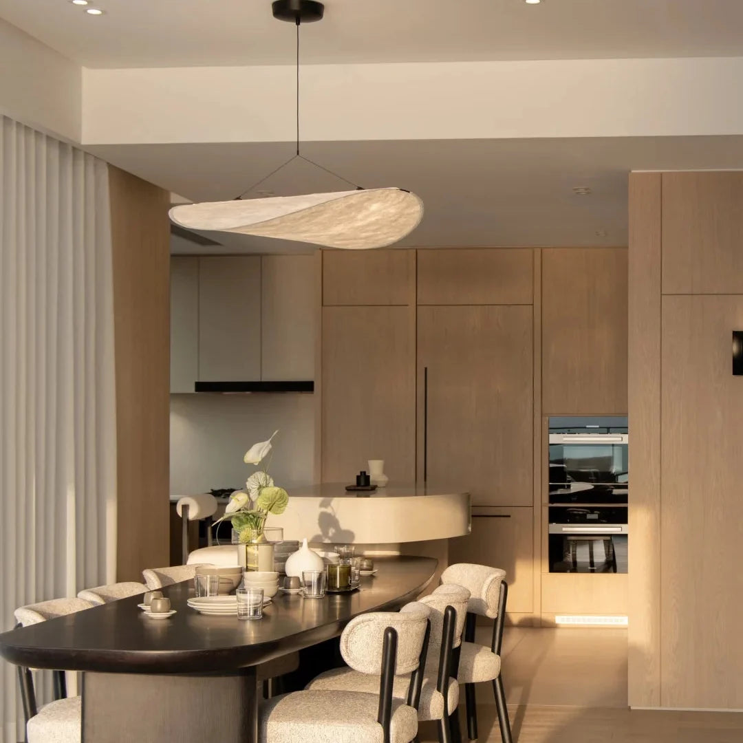 Ceiling-hung oval paper pendant light with warm beige shade