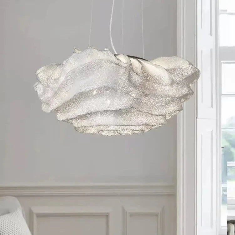 Cloud-shaped pendant light with layered silver-white shade suspended by cord
