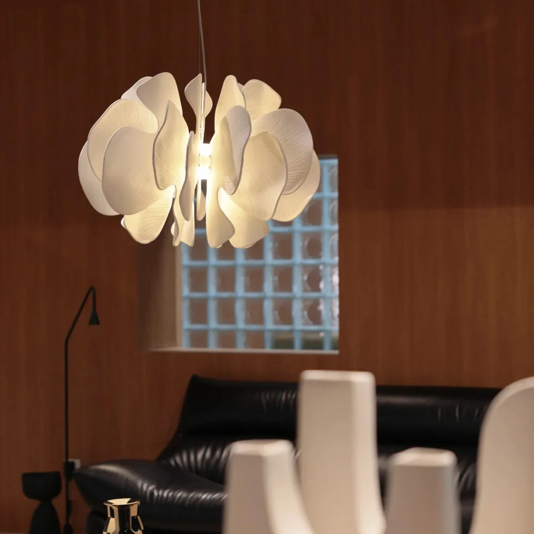 Ceramic petal chandelier close view with layered white petal shades and central bulbs