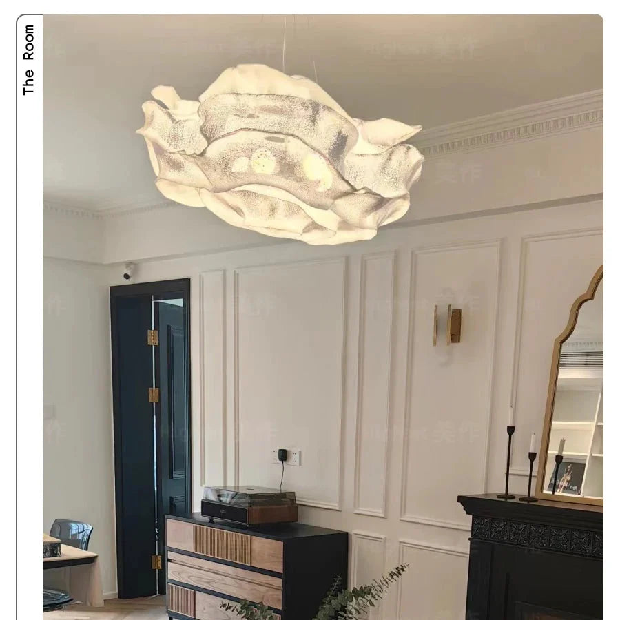 Cloud-shaped pendant light with textured, speckled pale finish