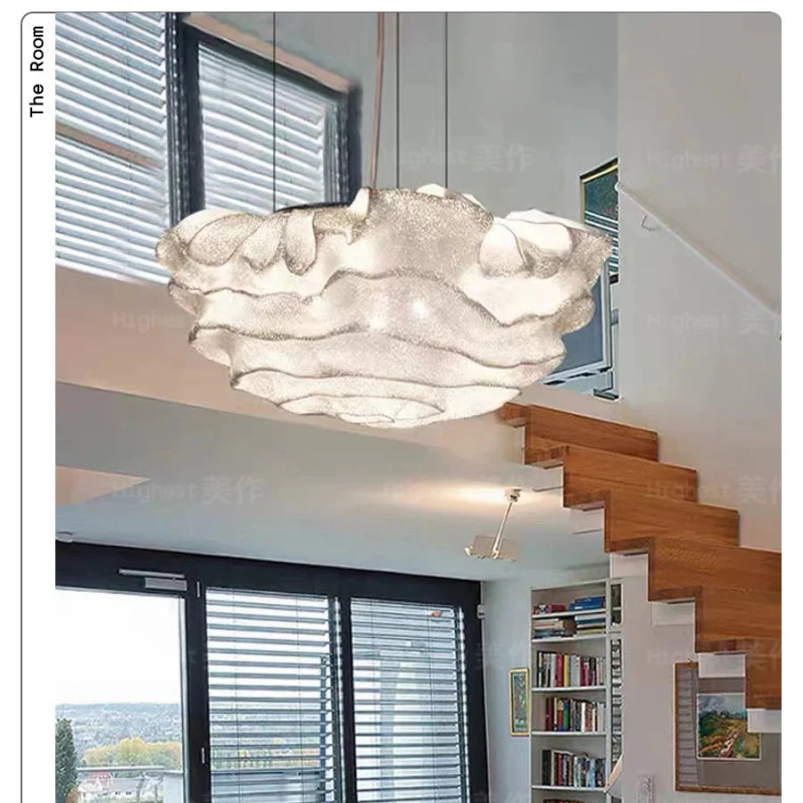 Cloud-shaped pendant light with layered cloud shade and hanging power cord