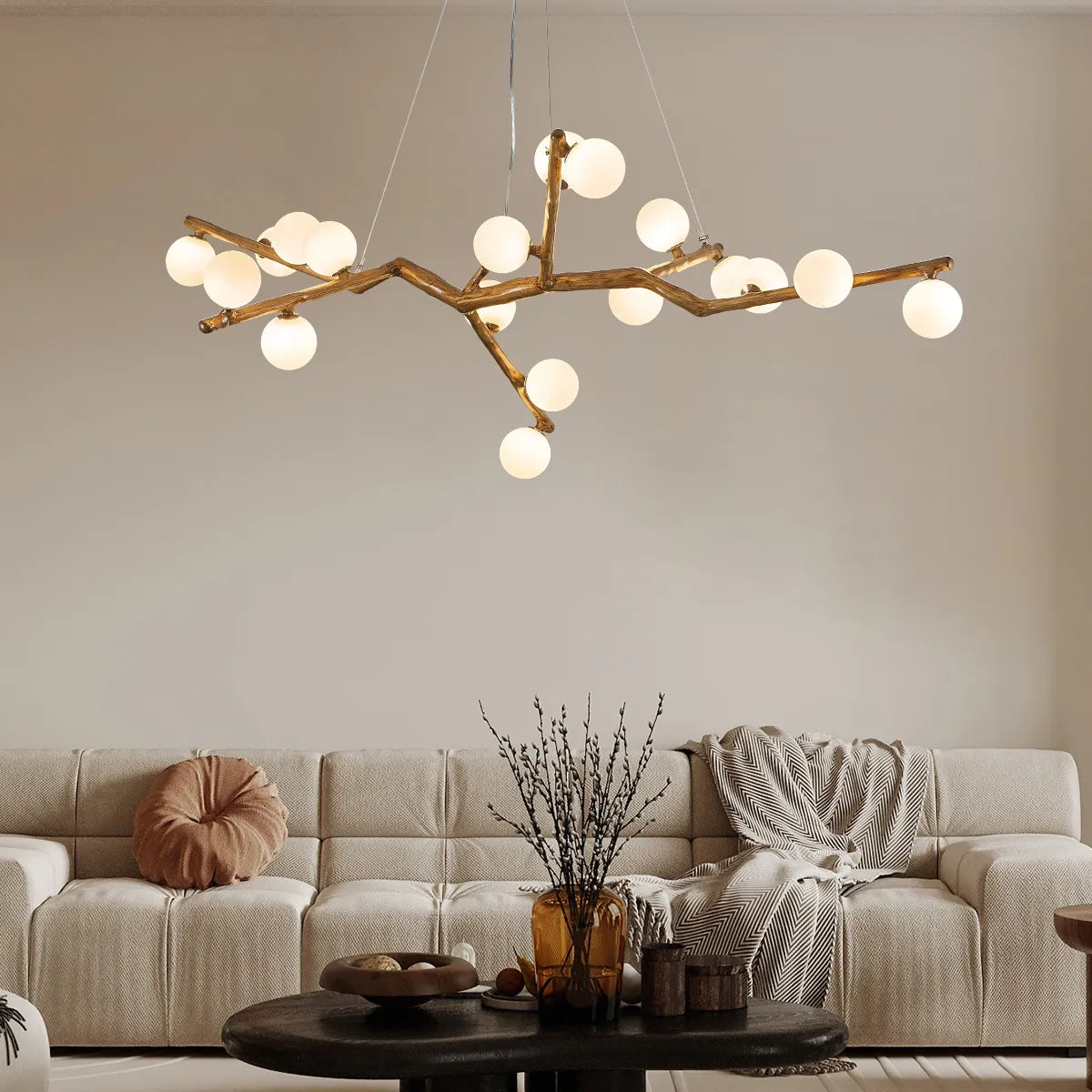 Branch chandelier overhead view with dark arms and evenly spaced white globe bulbs