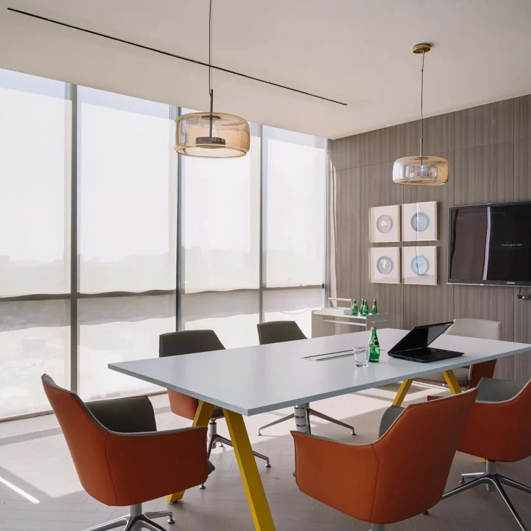Glass dome pendant lights with brass caps and glowing bulbs