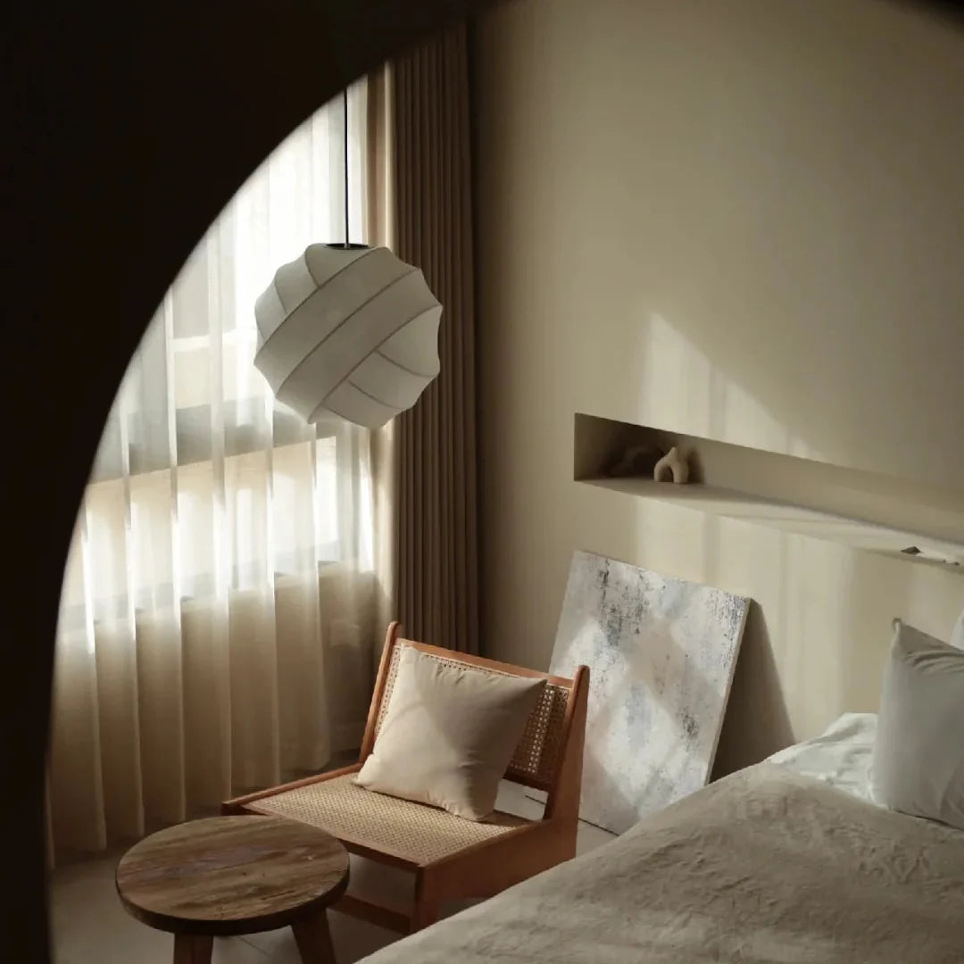 Luma silk pendant light with sand-colored pleated fabric shade and hanging cord