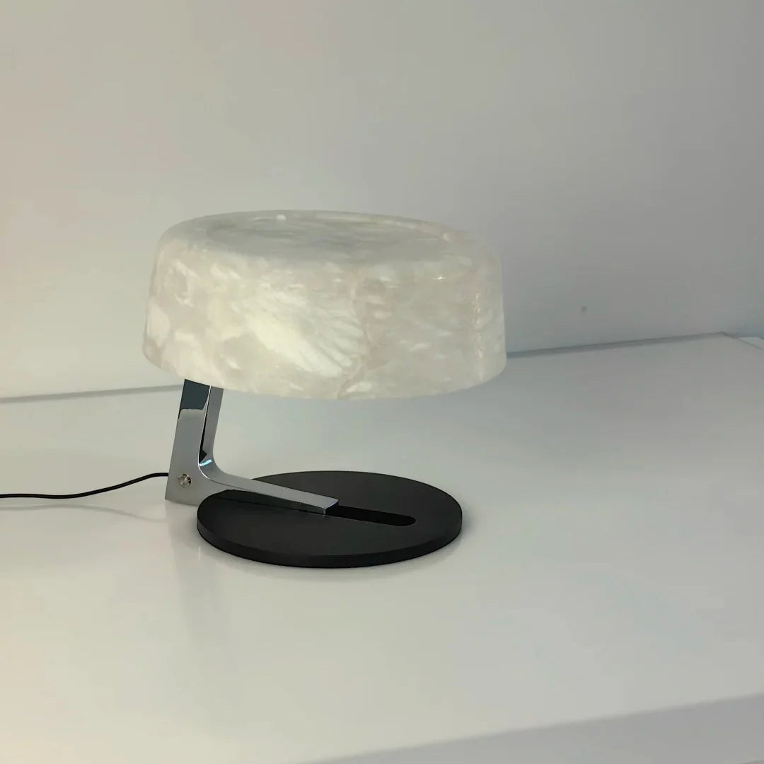 Alabaster table lamp with translucent opal shade and black circular base