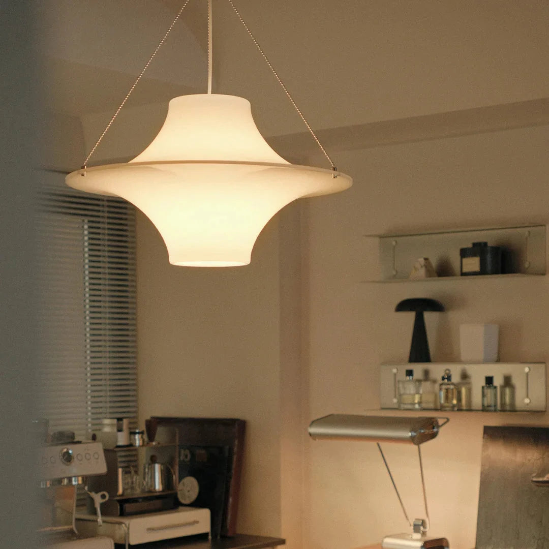 White opal disc pendant light with hanging cords, centered shade shape