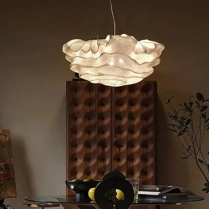 Cloud-shaped pendant light with warm silver-toned textured cloud shade