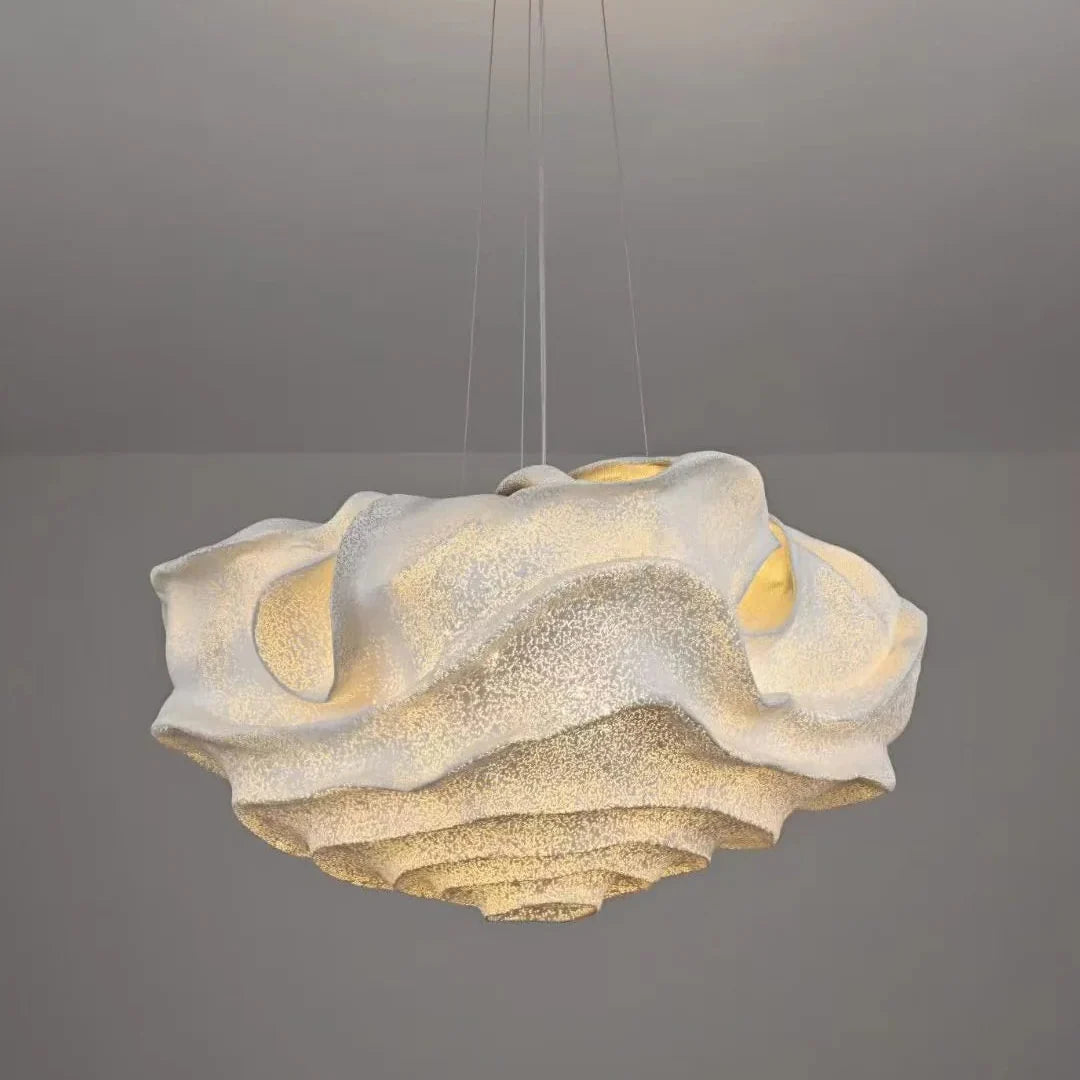 Cloud-shaped pendant light with textured ruffled diffuser and gold-tinted accents