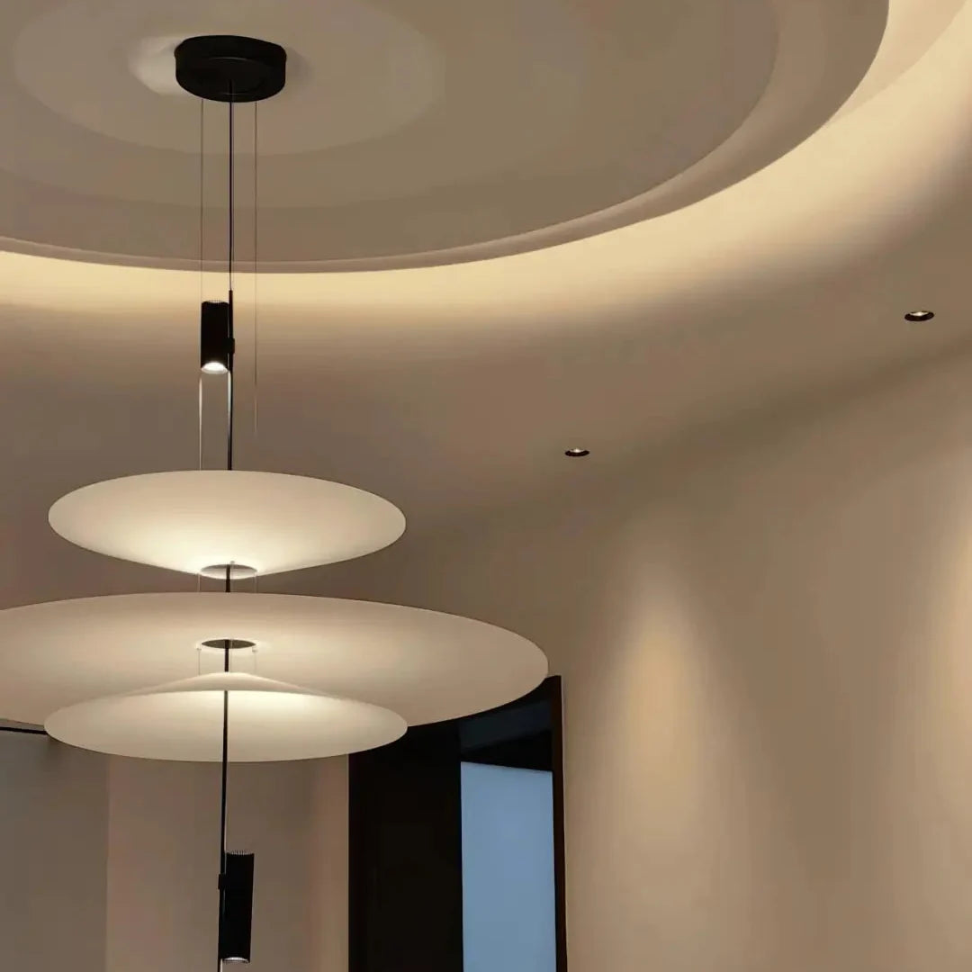 Stacked disc ceiling chandelier with white shades and black hanging accents