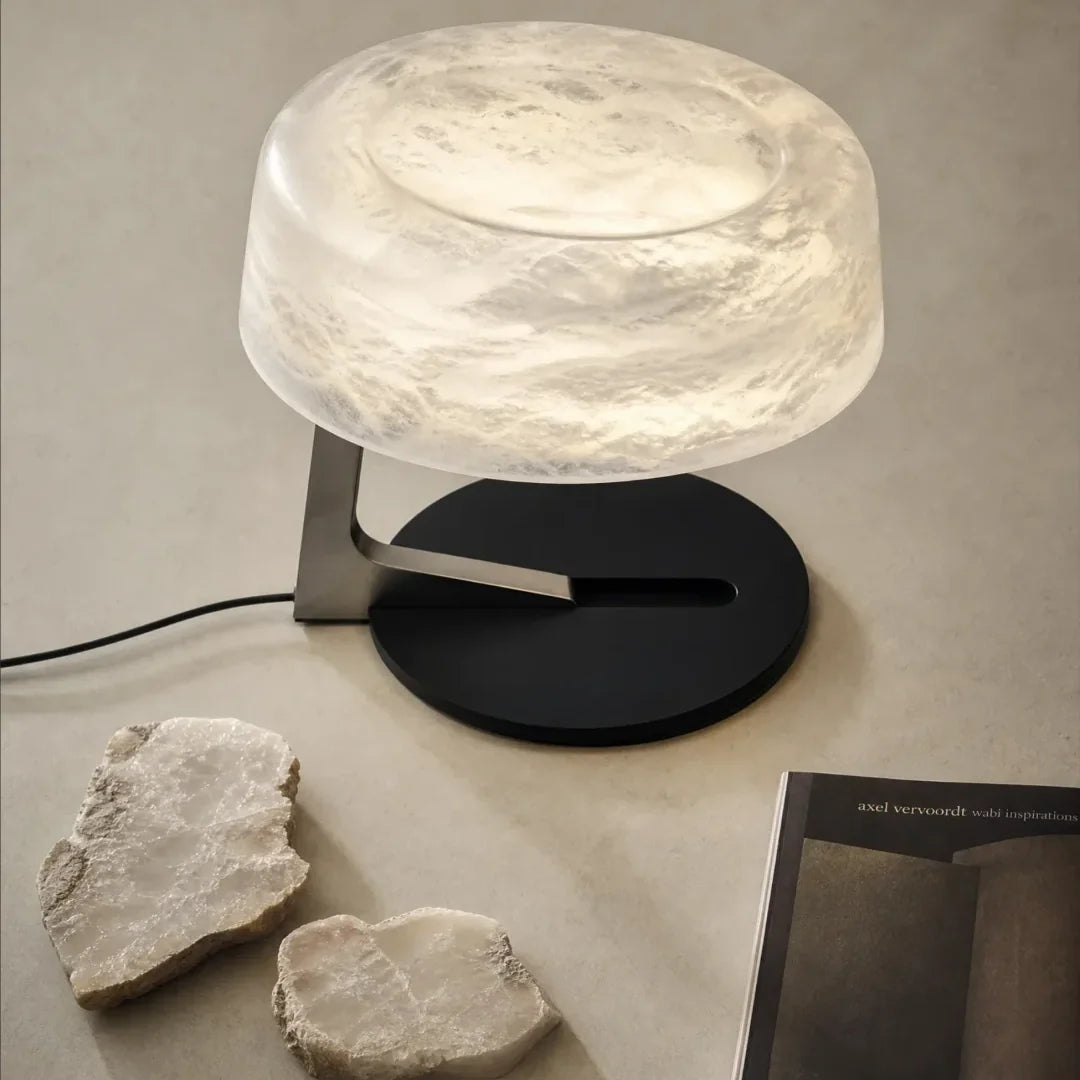 Alabaster table lamp with textured opal shade on black and brushed metal stand