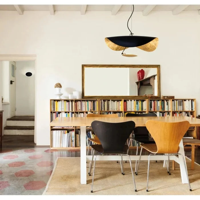 Ceiling-hung black and gold foil disc pendant light with two curved side sections