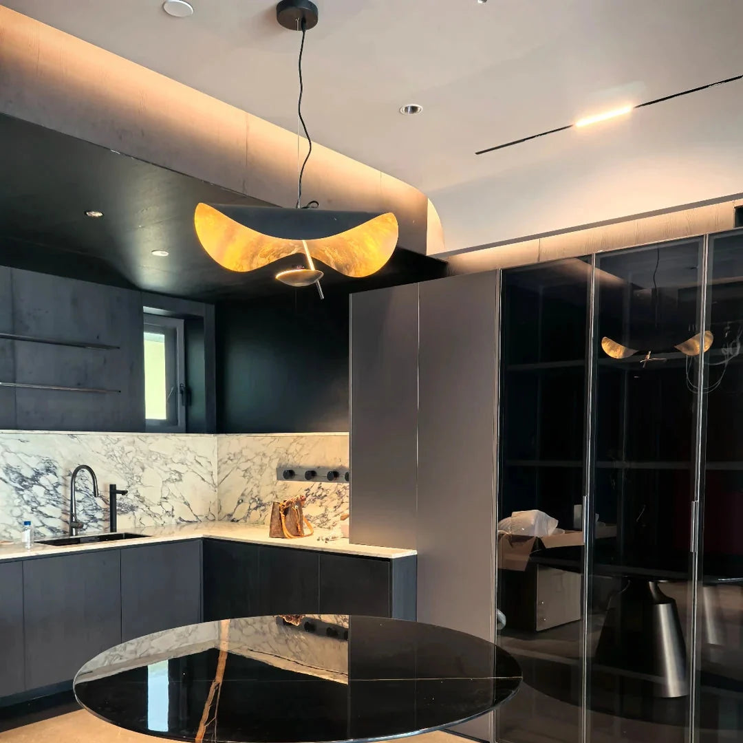 Black and gold foil disc pendant light featuring wide curved metal shades