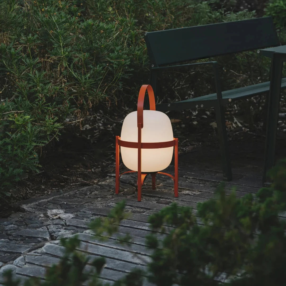 Warm glow table lamp with frosted glass shades and reddish-brown frame