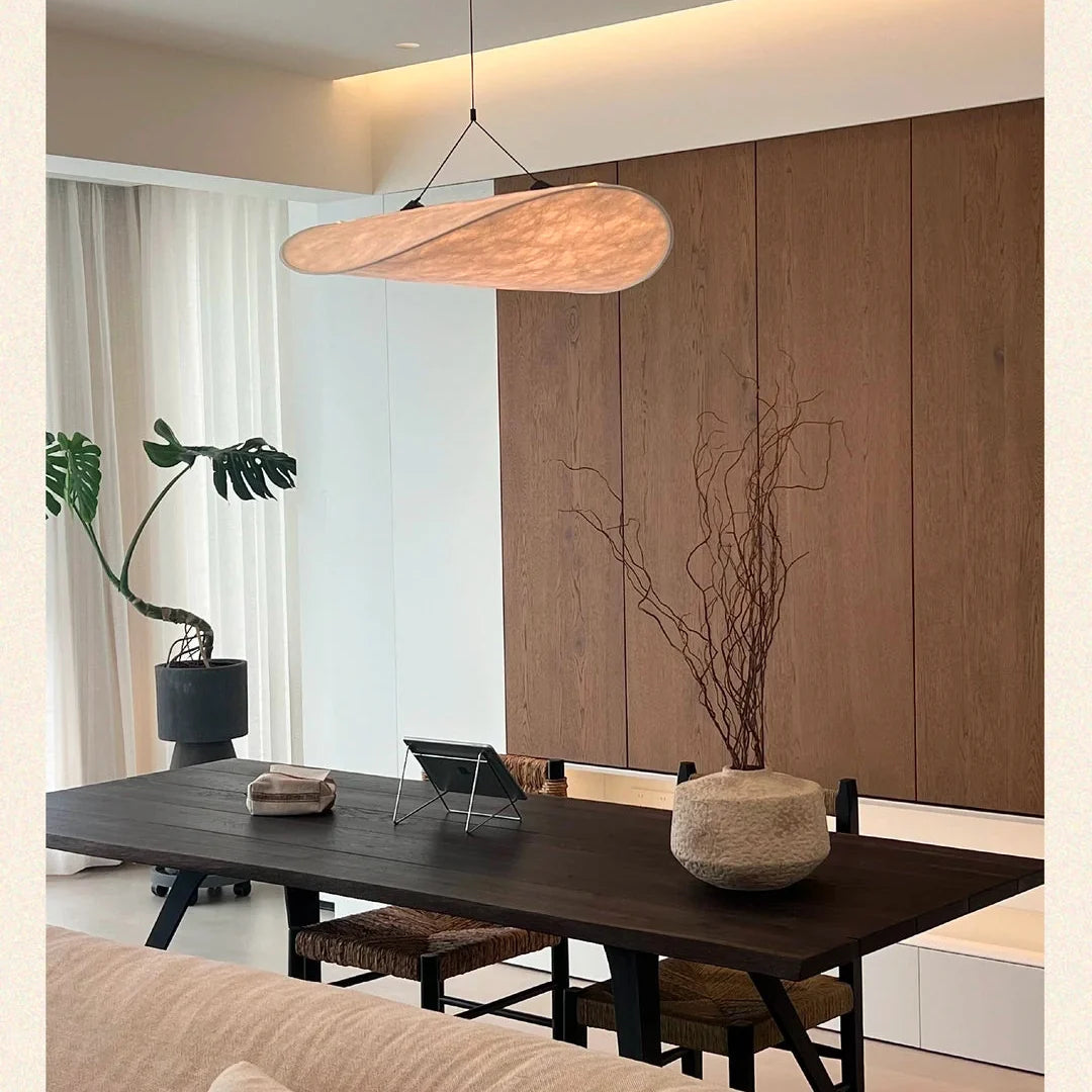 Oval paper pendant light with warm light-beige paper shade