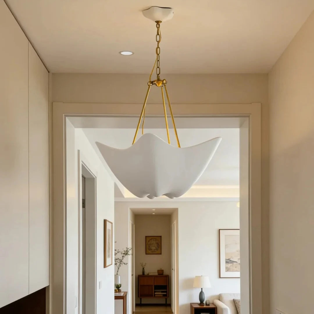 Chalk-white plaster chandelier with five petal shades and gold chain ceiling mount