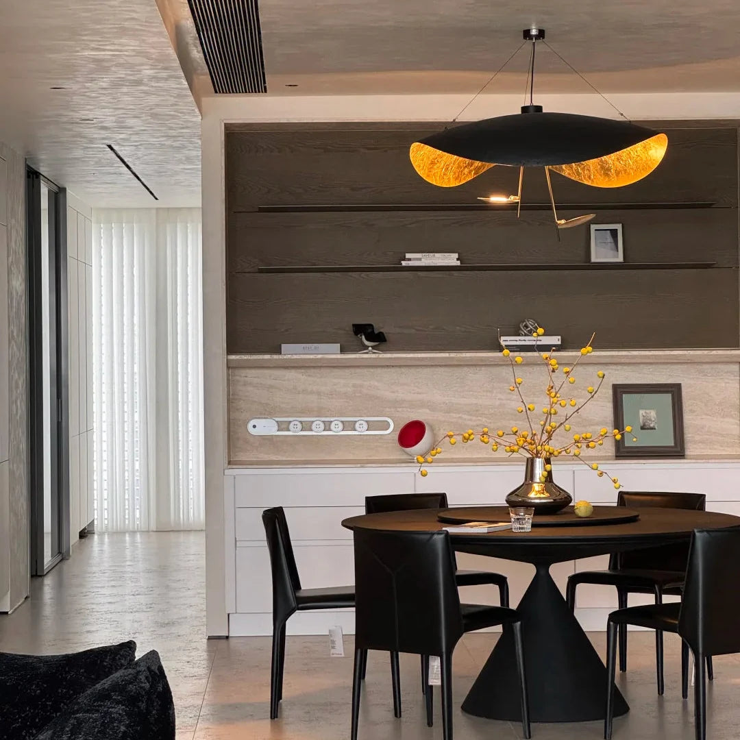 Black and gold foil disc pendant light with curved golden rim