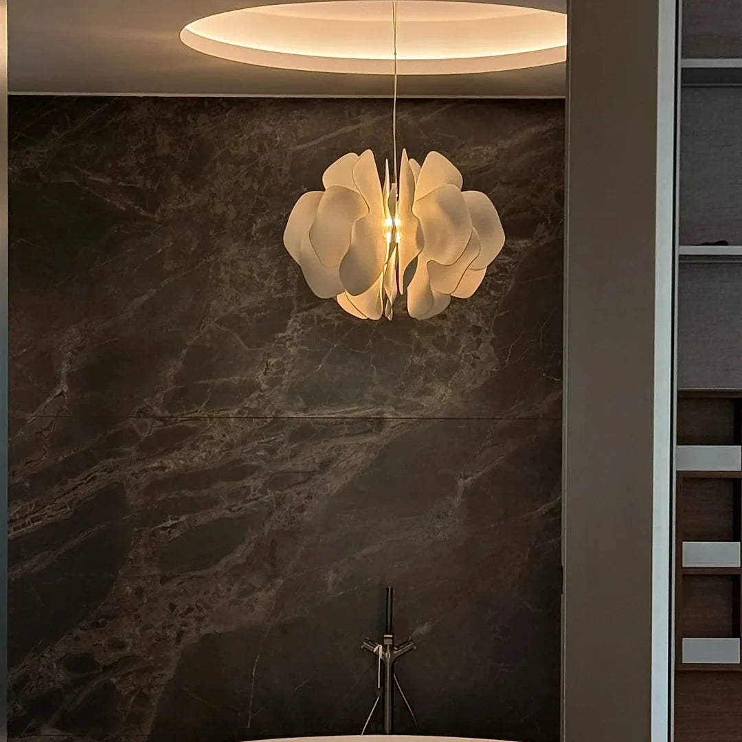 Ceramic petal chandelier with white petal shades and glowing center bulb