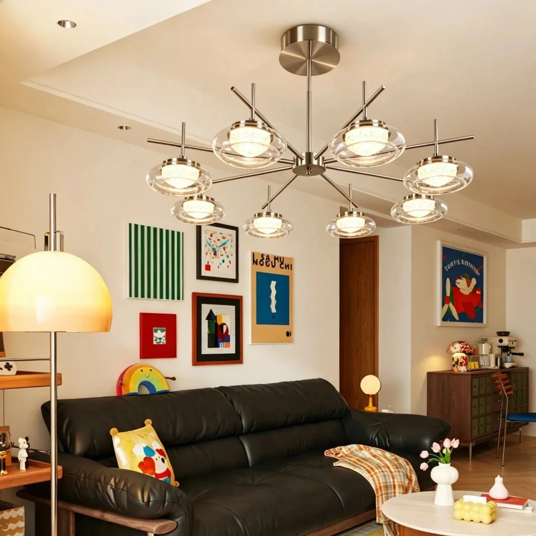 Brushed metal spider chandelier with clear glass bowl shades and multiple light bulbs.