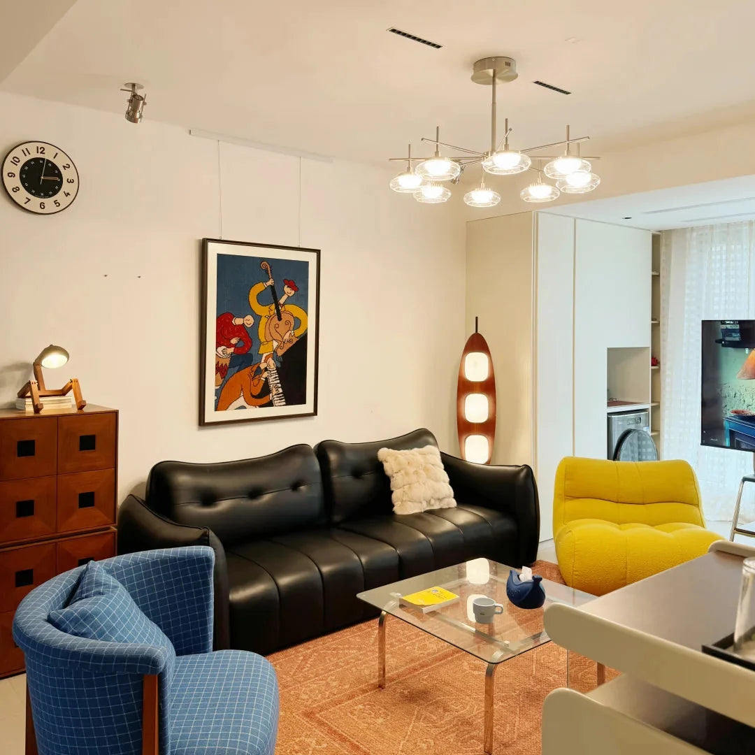 Spider ceiling chandelier with brushed metal arms and clear glass shades.