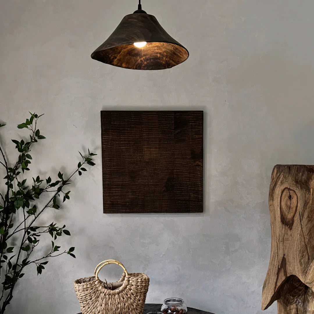 Cone wood pendant light with dark wood cone shade and warm bulb, hanging from ceiling