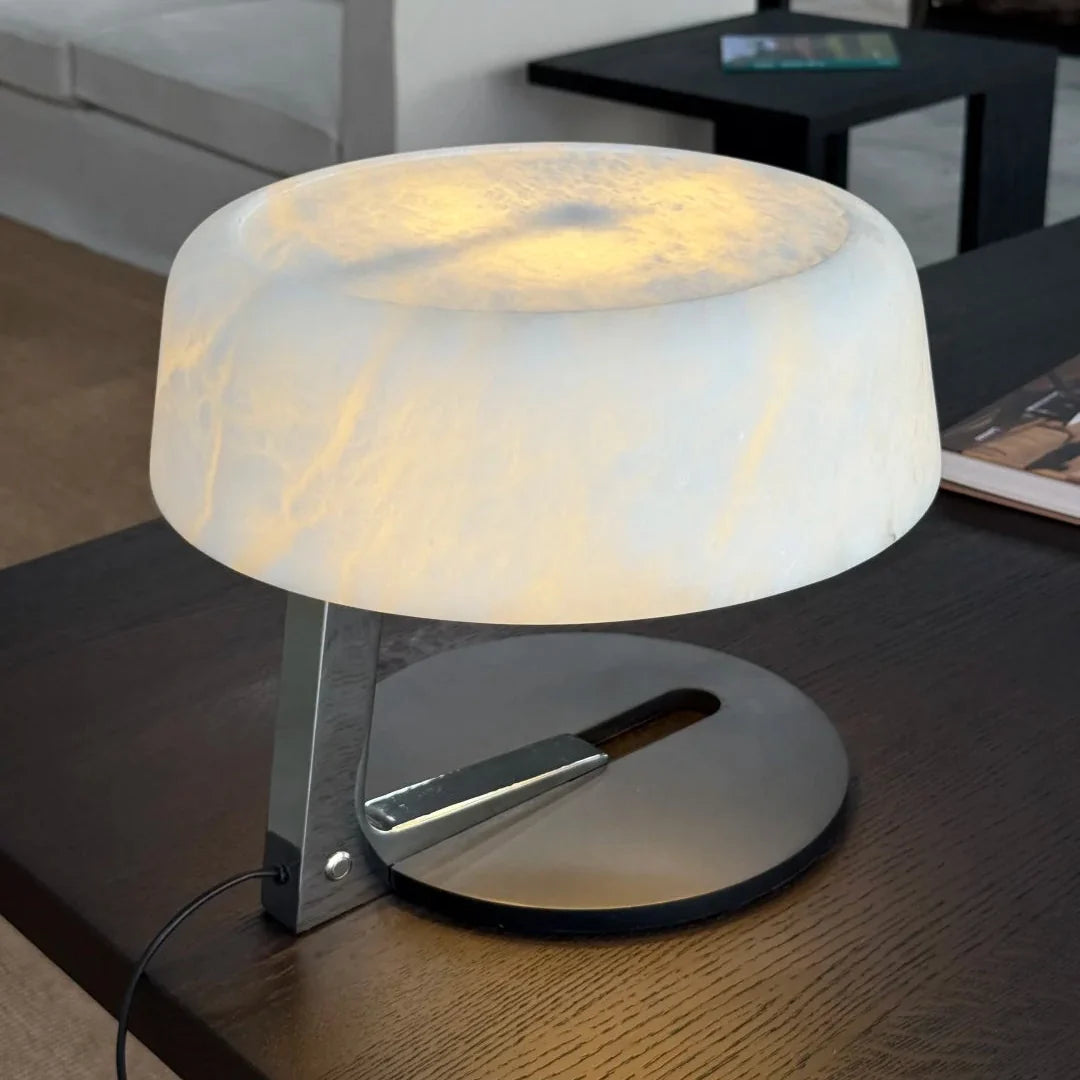 Alabaster table lamp with illuminated opal dome shade and black circular base