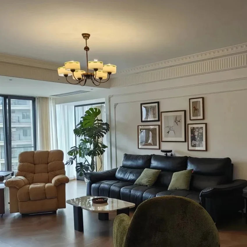 Bronze chandelier with cream opal glass shades and curved arms on a ceiling mount
