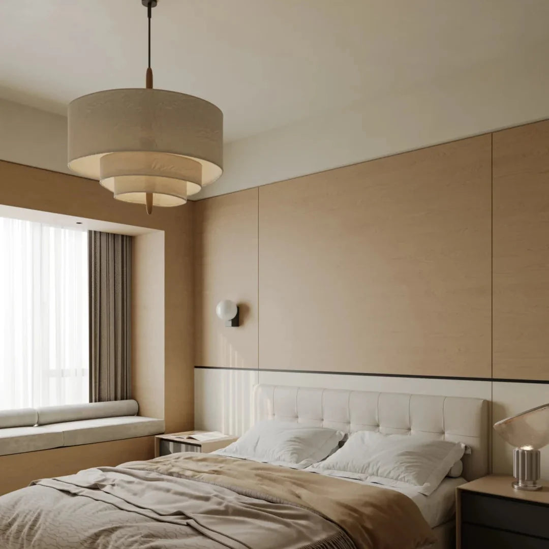 Layered beige linen pendant light with stacked drum shades