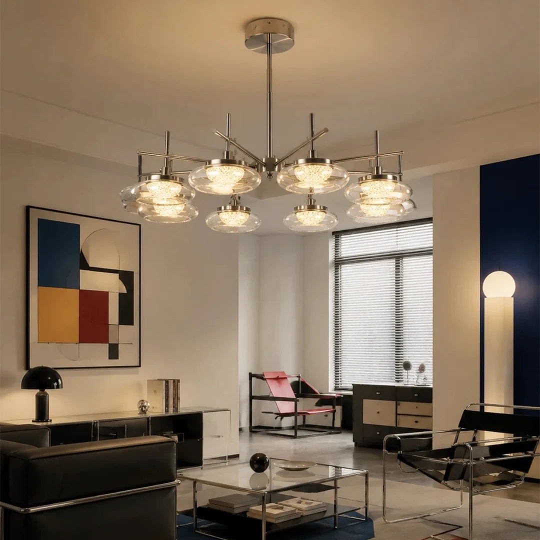Ceiling spider chandelier with brushed metal arms and clear glass bowl shades.