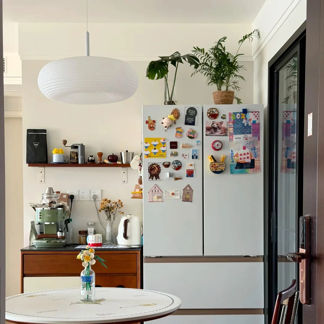 Luma Pebble pendant light with ribbed white dome shade and white ceiling canopy