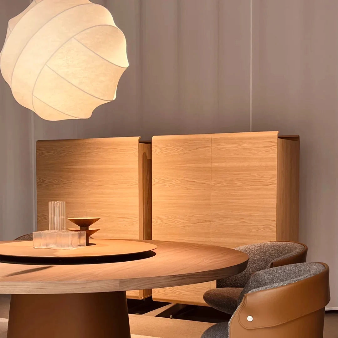 Luma silk pendant light with warm beige pleated shade suspended overhead