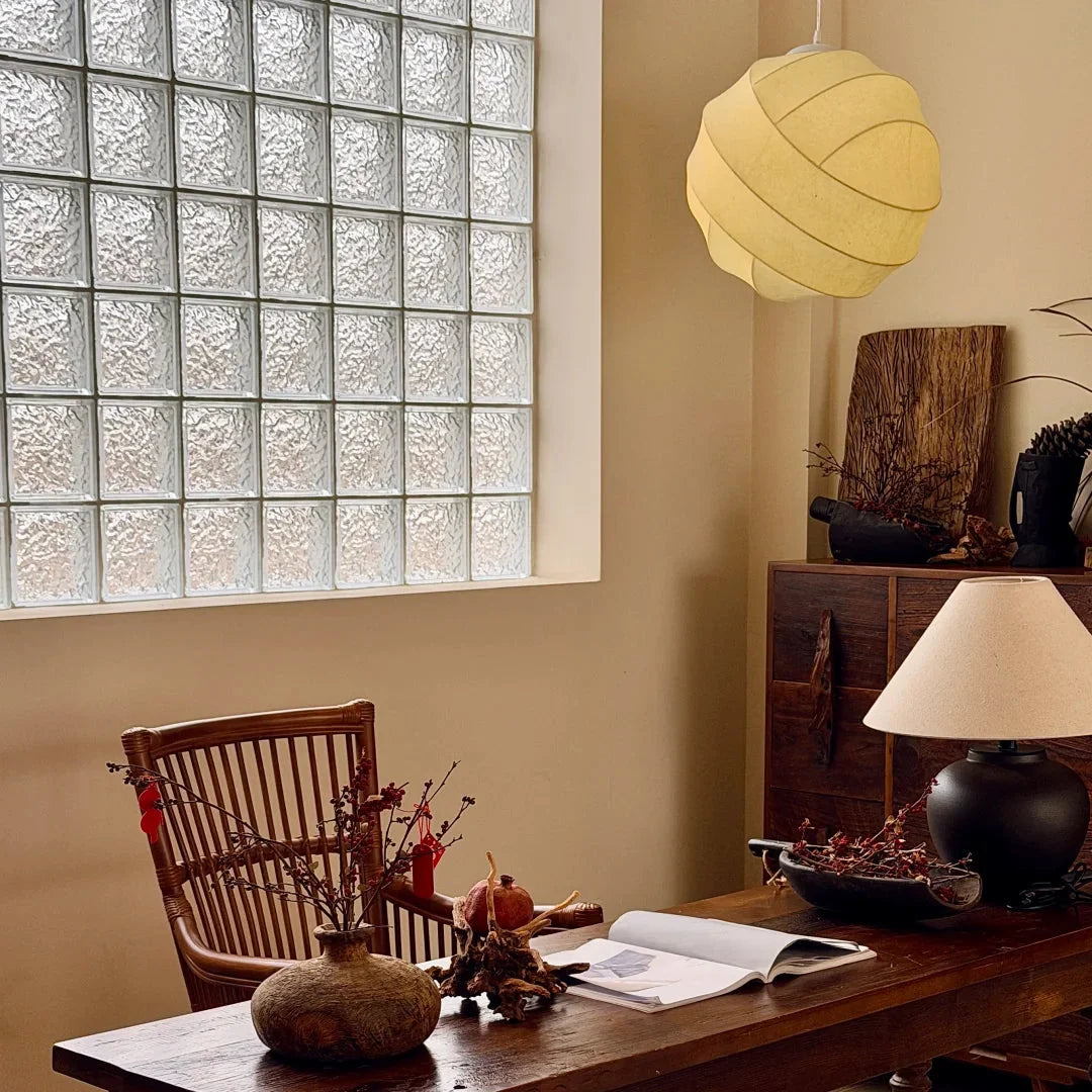 Cream silk pendant light with scalloped fabric shade on cord