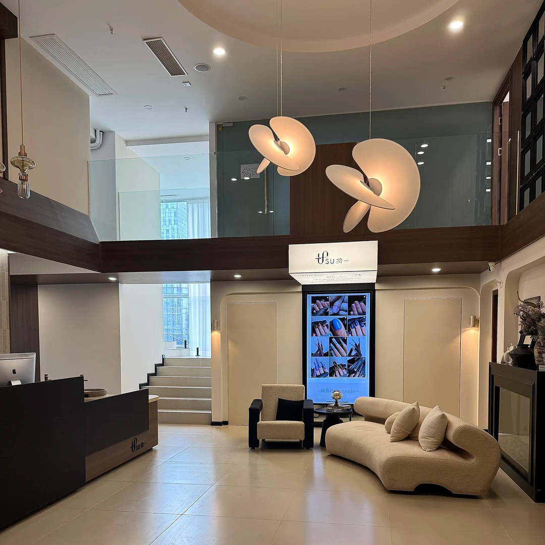 Butterfly pendant light set with two white dome shades and crossed blades