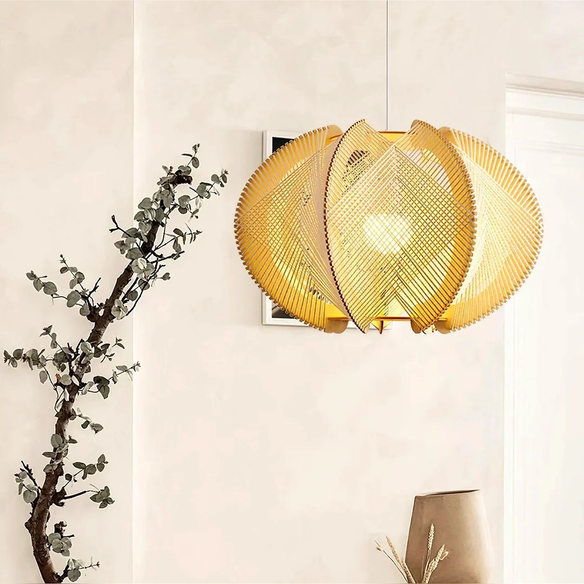 Beige woven orbit pendant lamp with layered round shade and visible light bulb