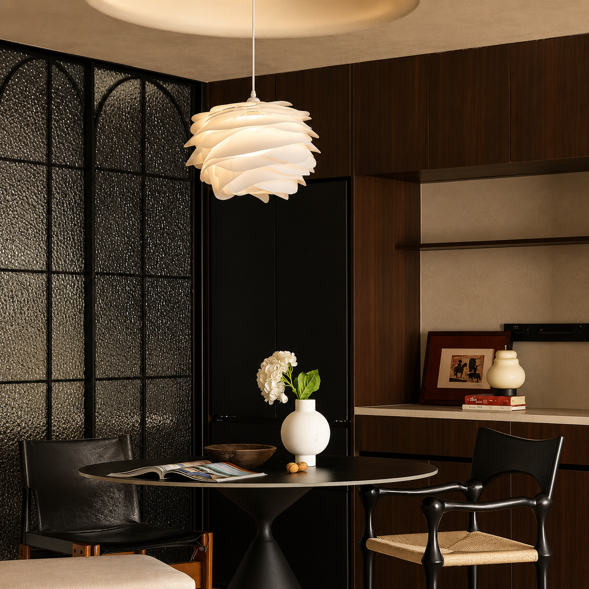 White petal swirl pendant light with layered petal shade over side table