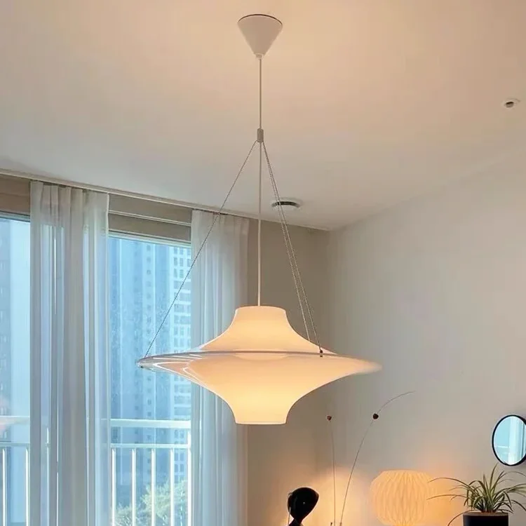 White opal disc pendant light with hanging cables and flared shade